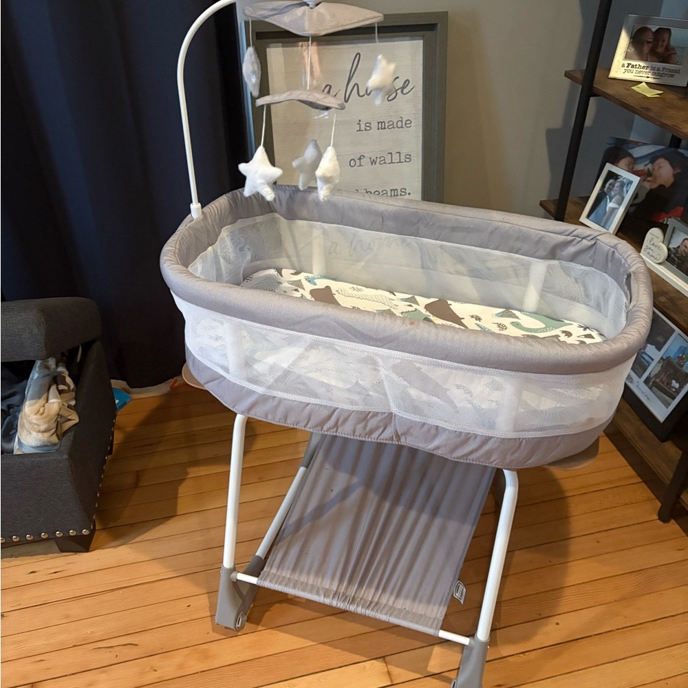 Gray Baby Bassinet with Star Mobile